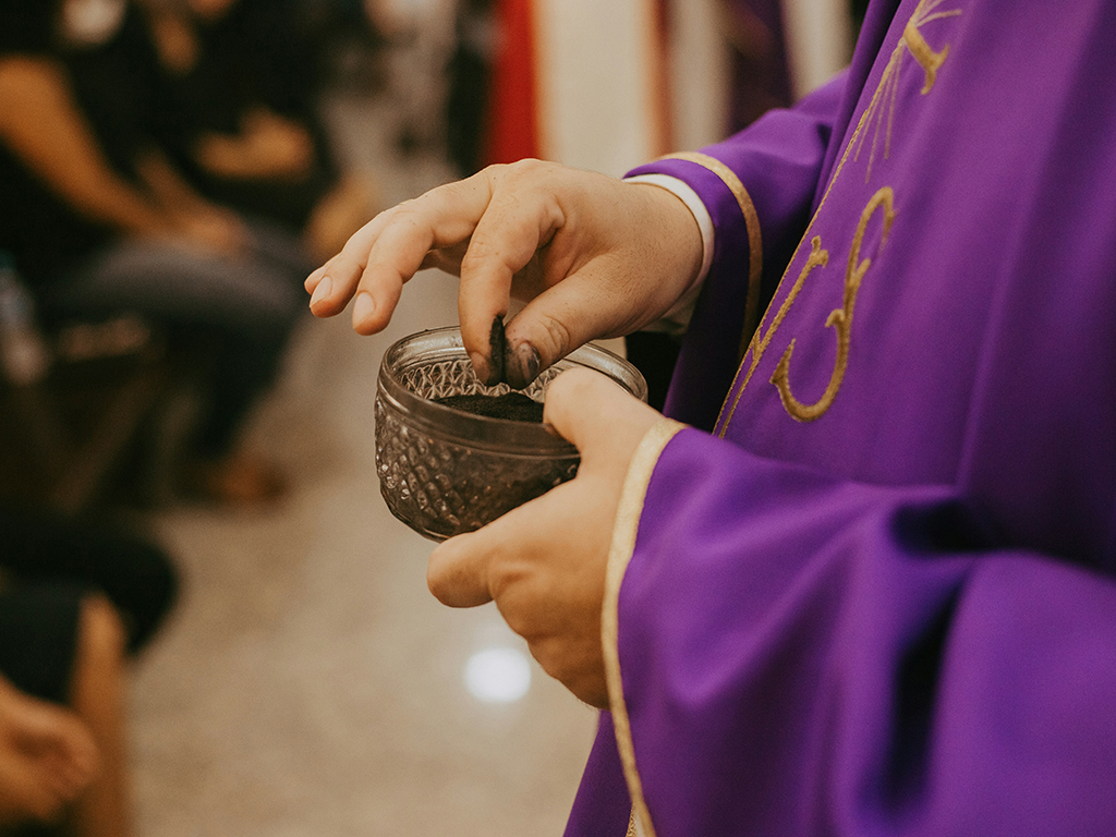 Sacred Ritual: Priest Imposing Ashes on Ash Wednesday